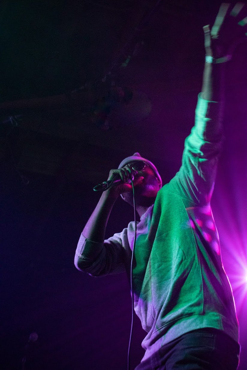 African Dundada crouching on stage