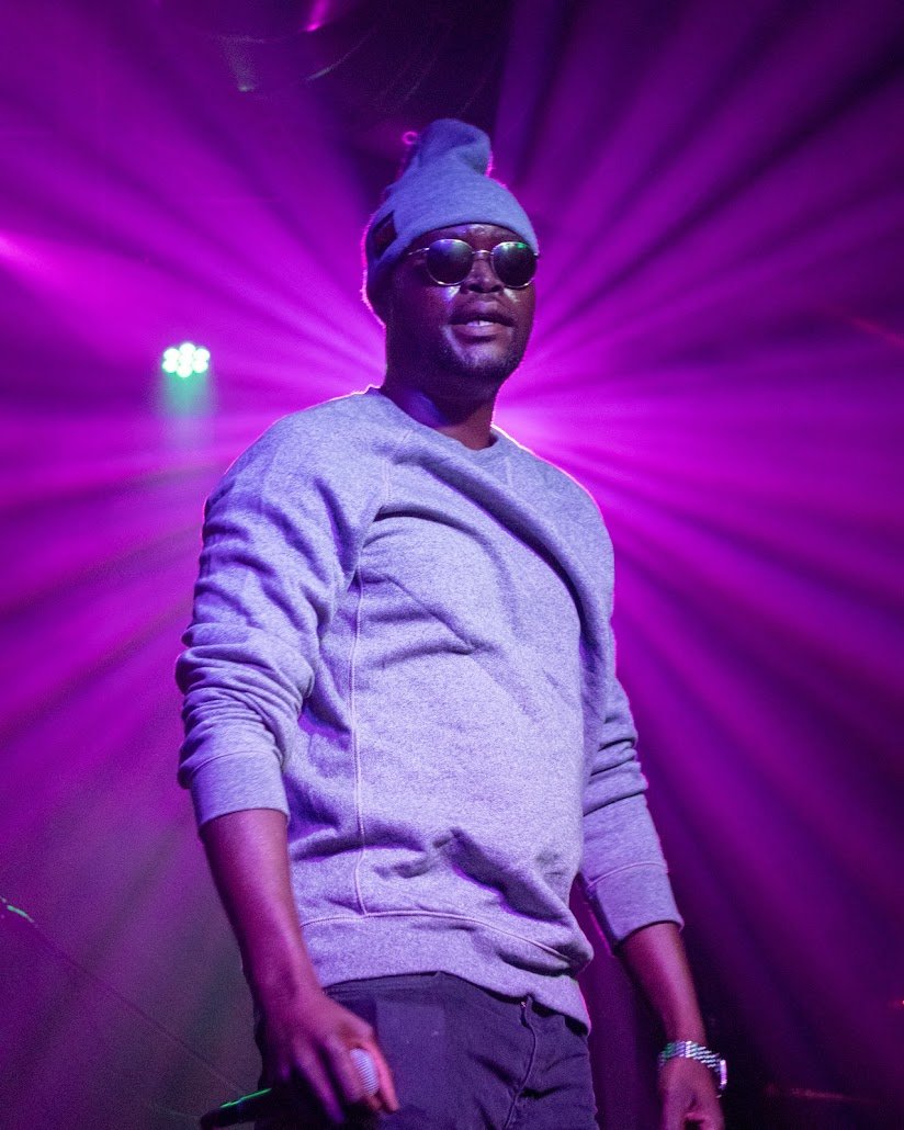 African Dundada on stage — purple spotlight