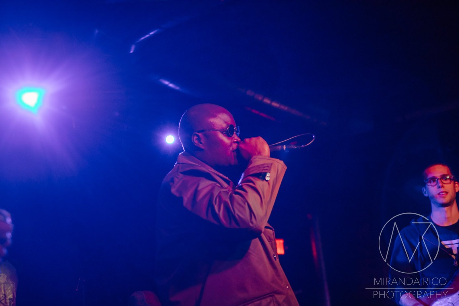 African Dundada crouching stage blue light